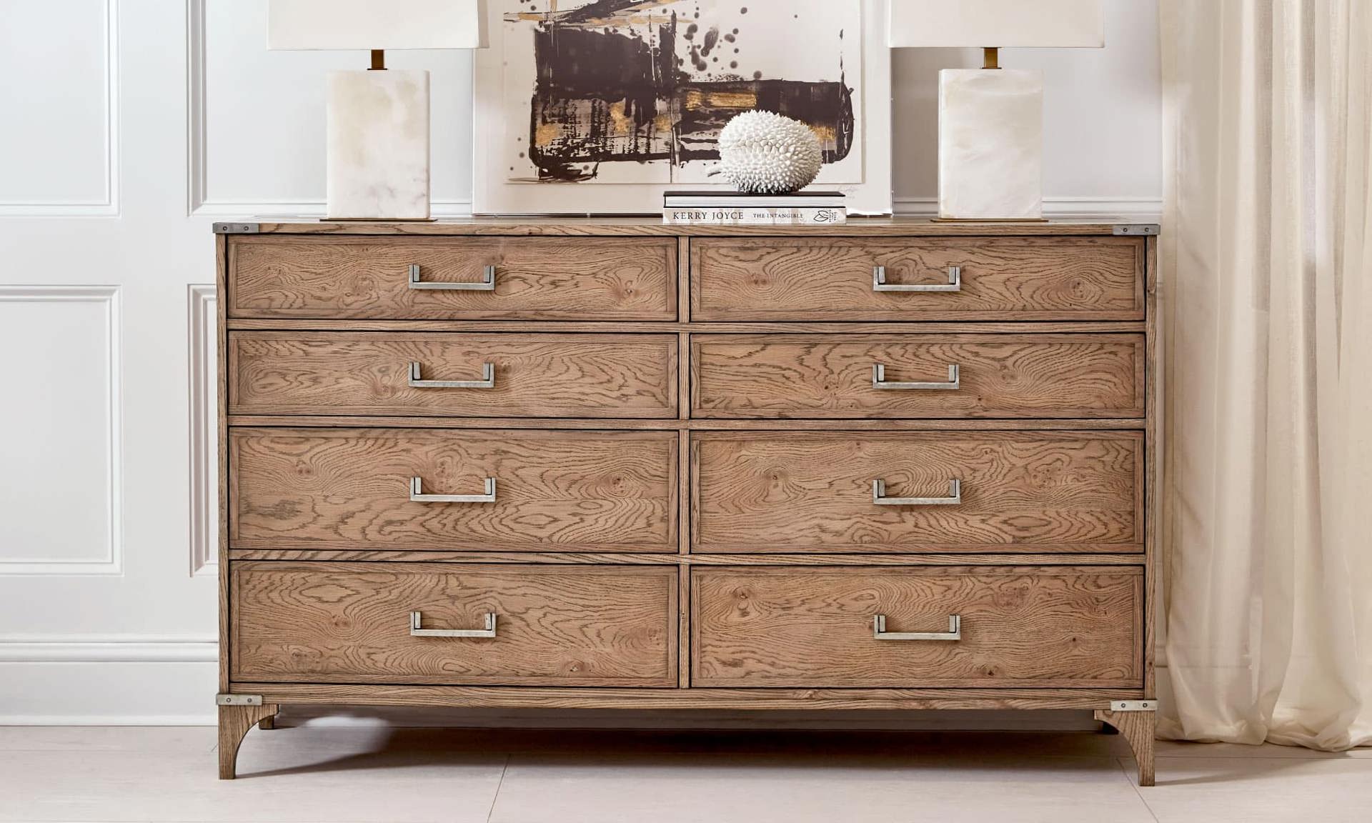 Transitional brown dresser with unique handles is the perfect piece of furniture for your bedroom.