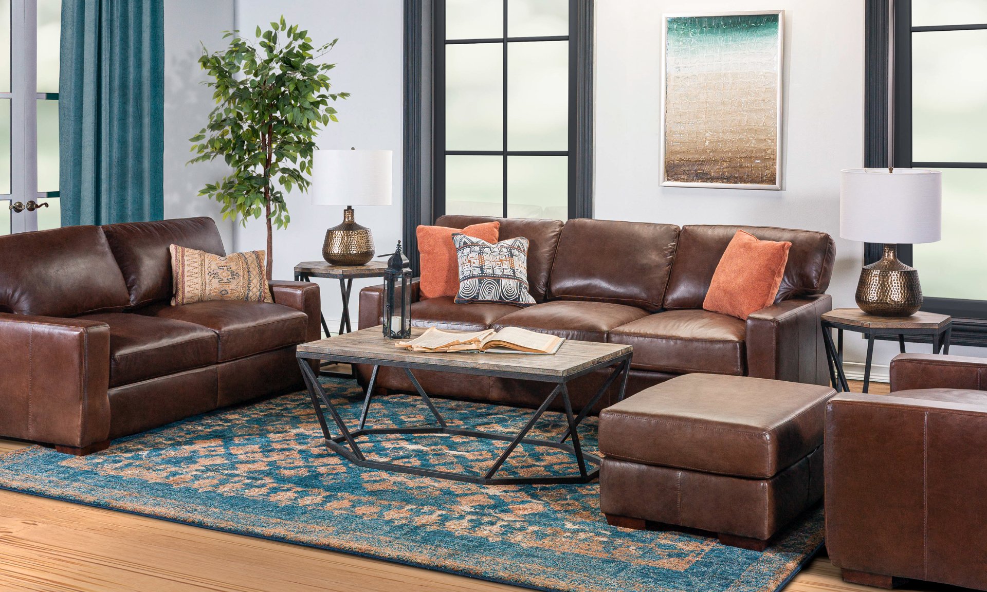 Living room set featuring a brown leather sofa and loveseat.